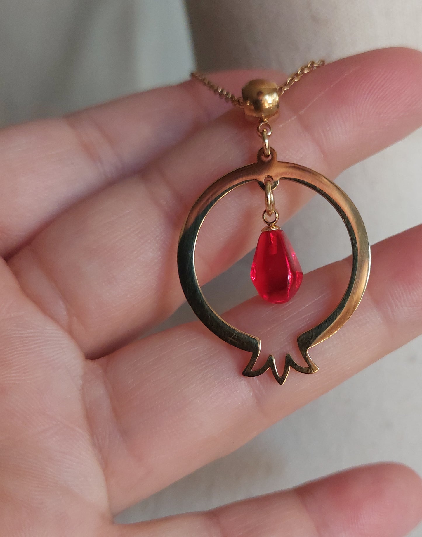 Pomegranate-shaped pendant and delicate matching earrings with glass beads