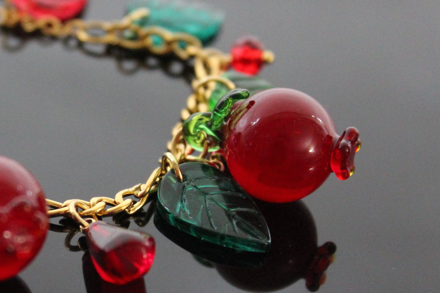 Glass charms, adjustable up to 9 in  gold  plated stainless steel pomegranate bracelet