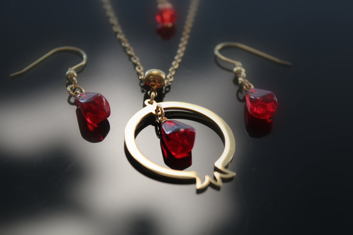 Pomegranate-shaped pendant and delicate matching earrings with glass beads