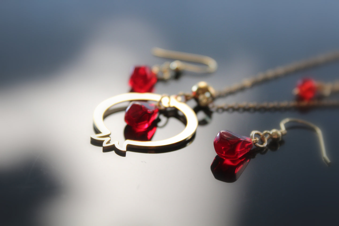 Pomegranate-shaped pendant and delicate matching earrings with glass beads