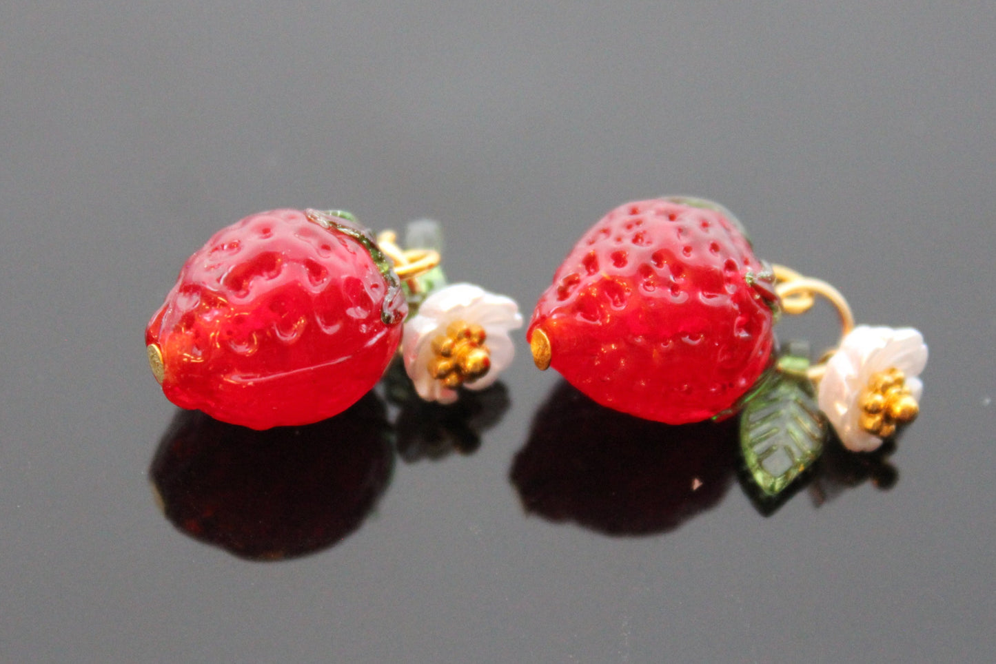 Red glass strawberry beads with plastic leaf and flower for jewelry making