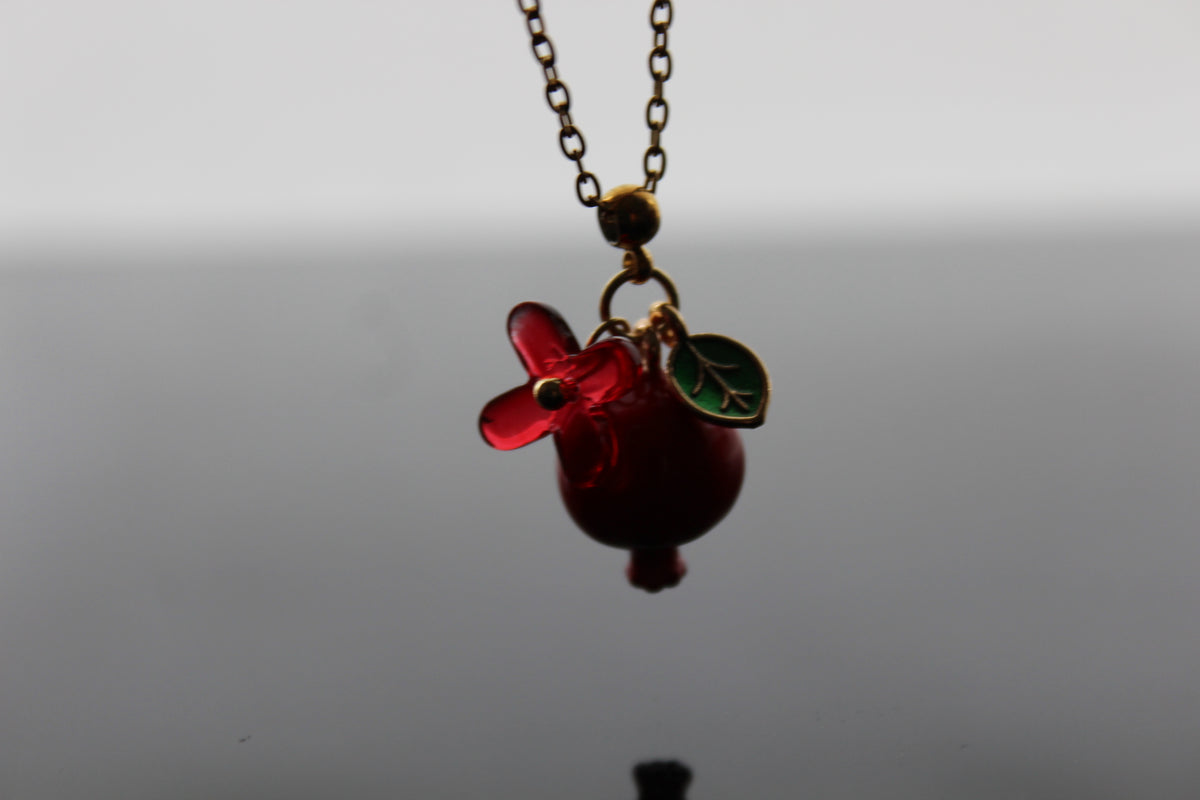 Handmade pomegranate enamel pendant with glass flower and enamel green leaf