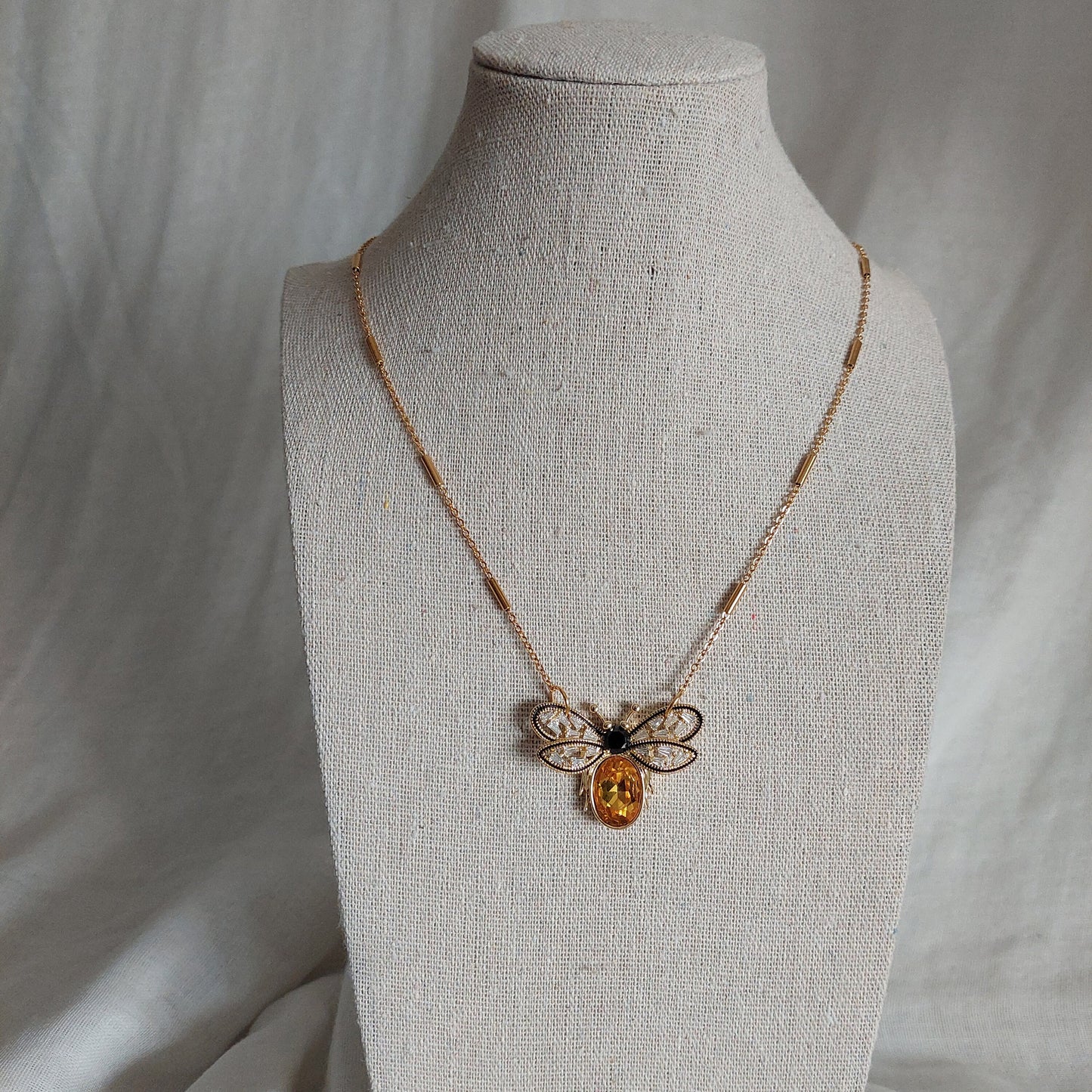 Gold plated bee pendant with natural onyx and crystals