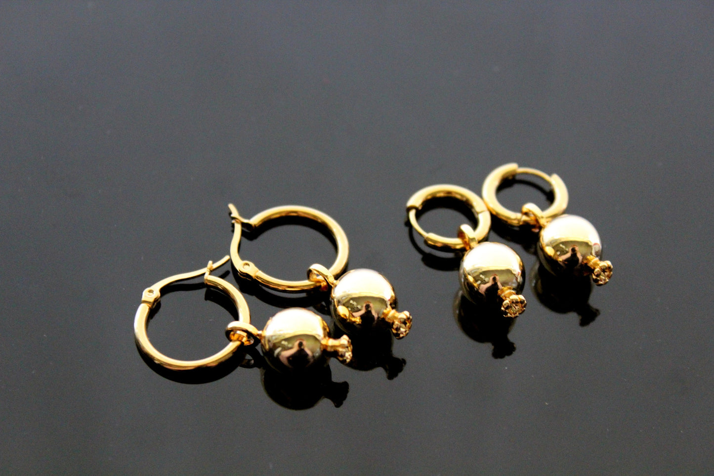 Gold plated pomegranate hoop earrings with red zircons