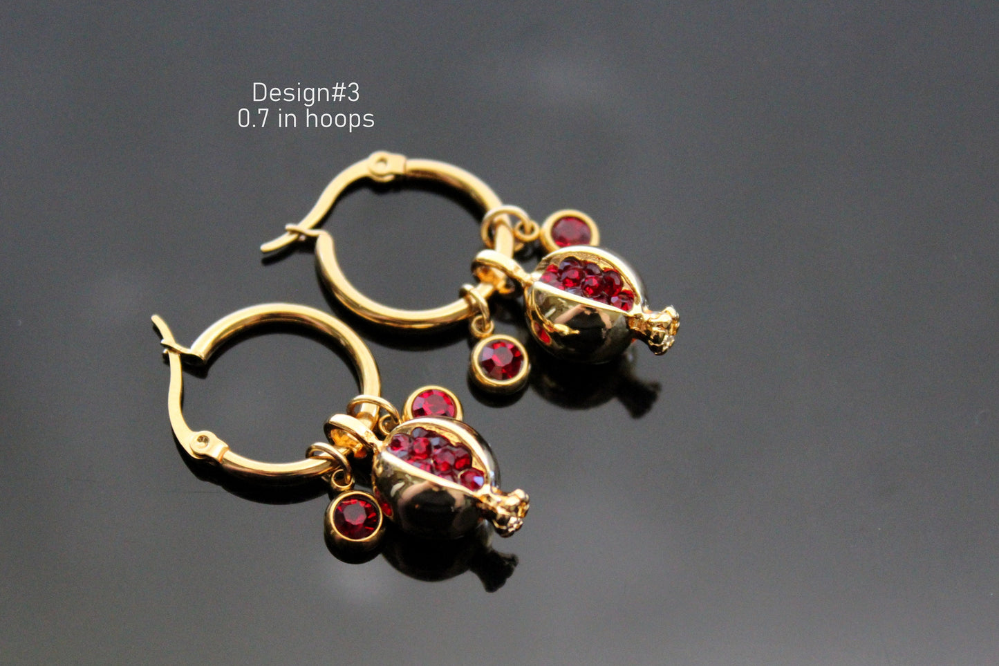 Gold plated pomegranate hoop earrings with red zircons