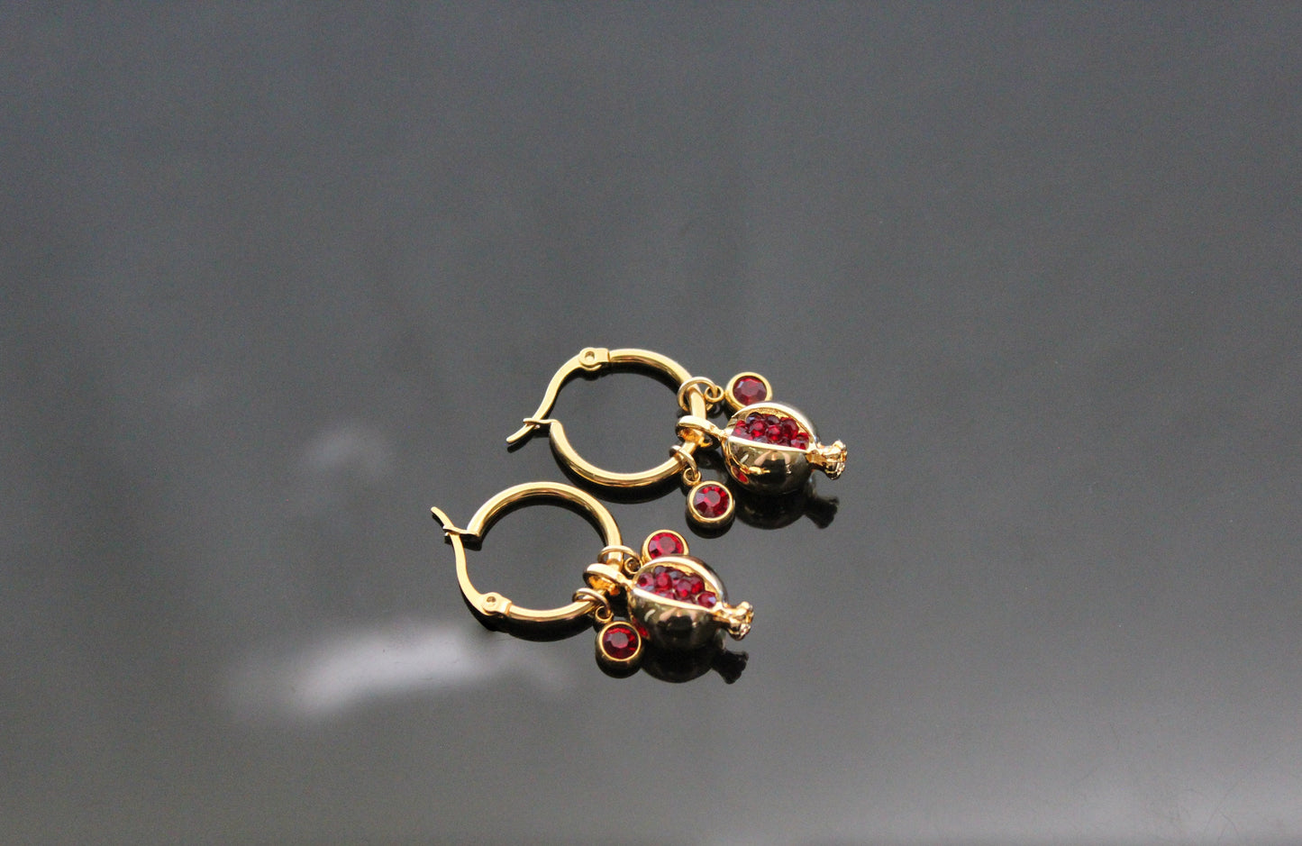 Gold plated pomegranate hoop earrings with red zircons