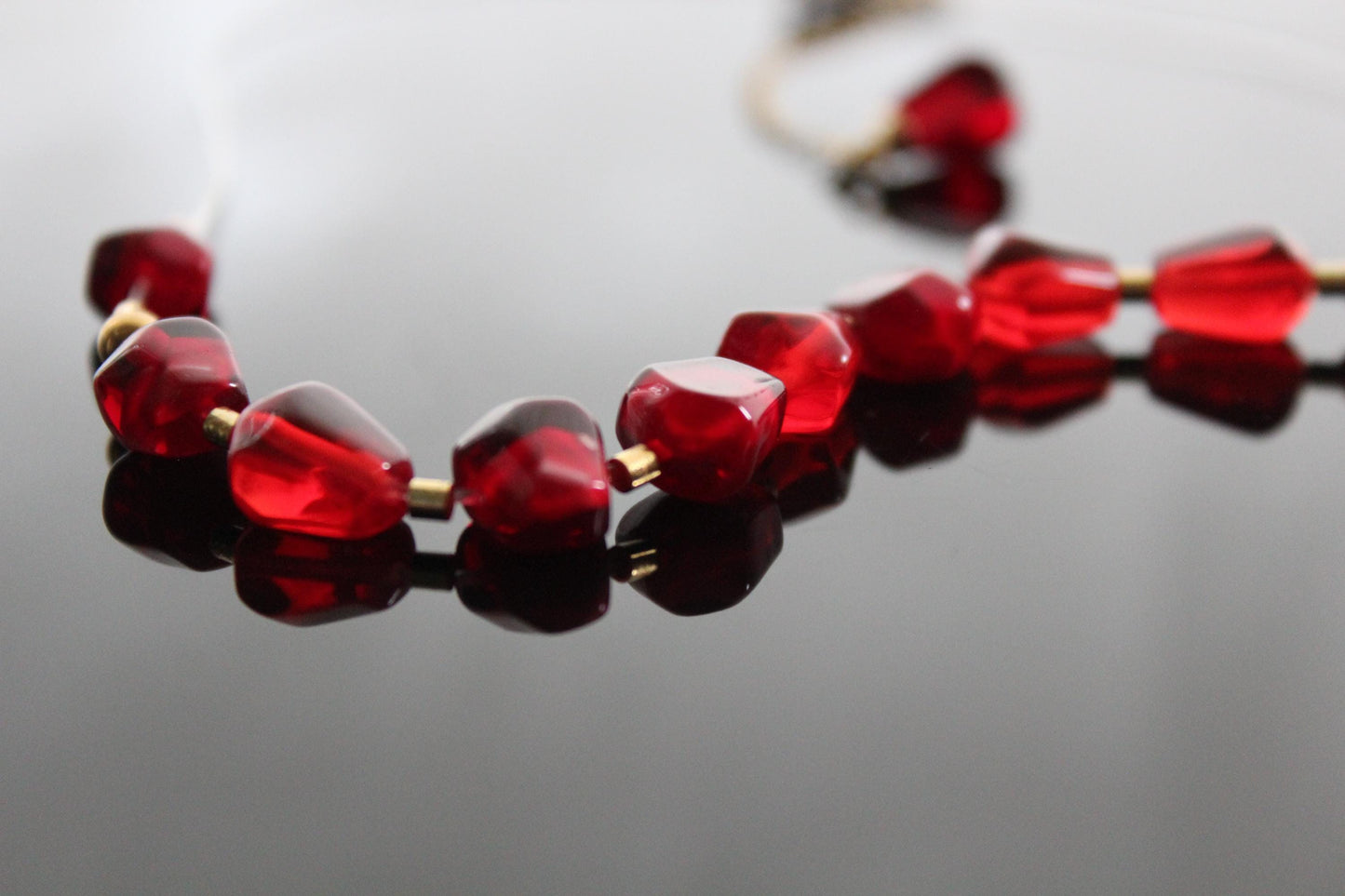 Pomegranates resin seeds on see-through wire