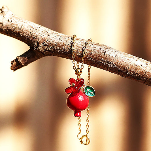 Handmade pomegranate enamel pendant with glass flower and enamel green leaf