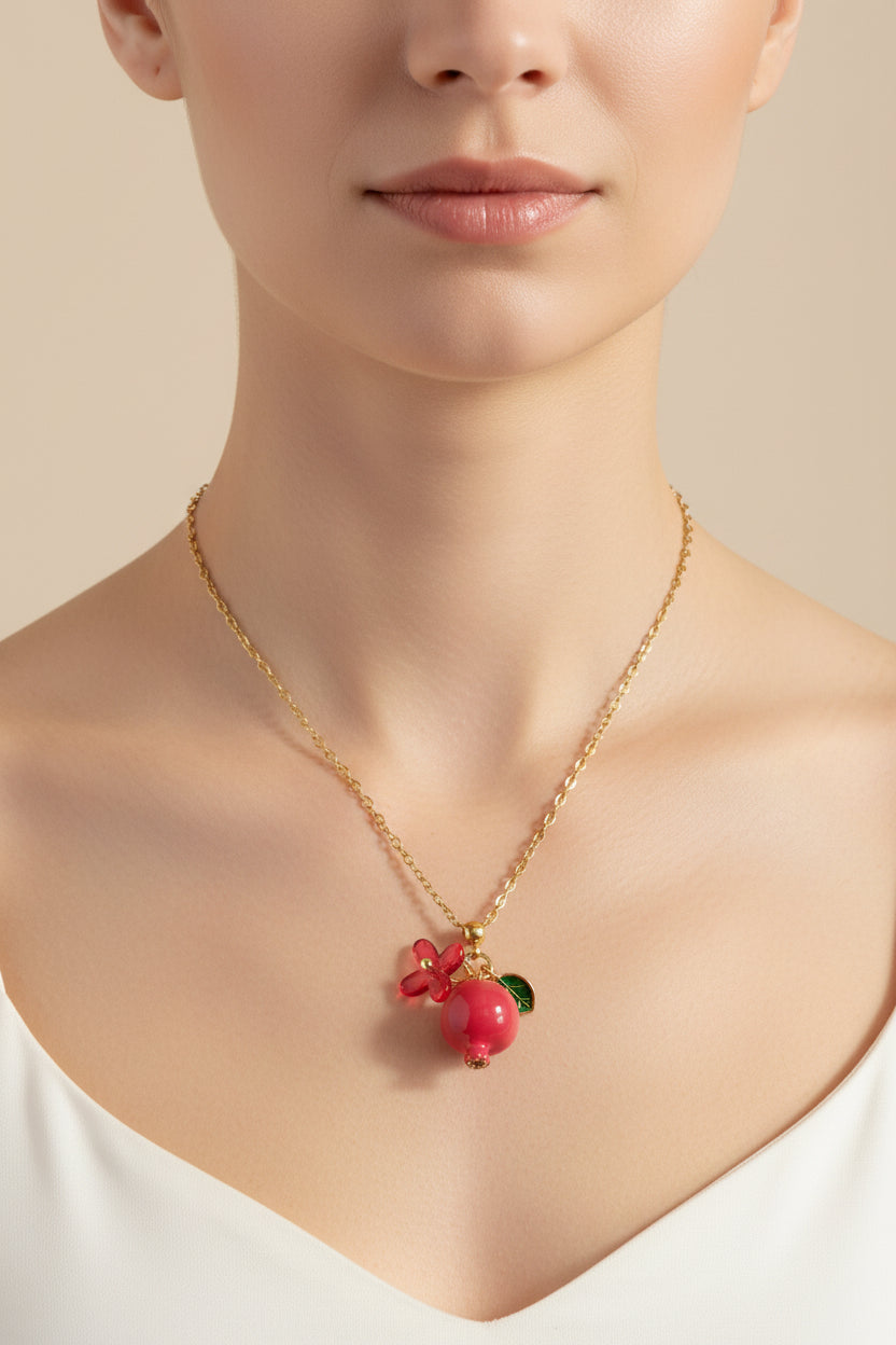 Handmade pomegranate enamel pendant with glass flower and enamel green leaf