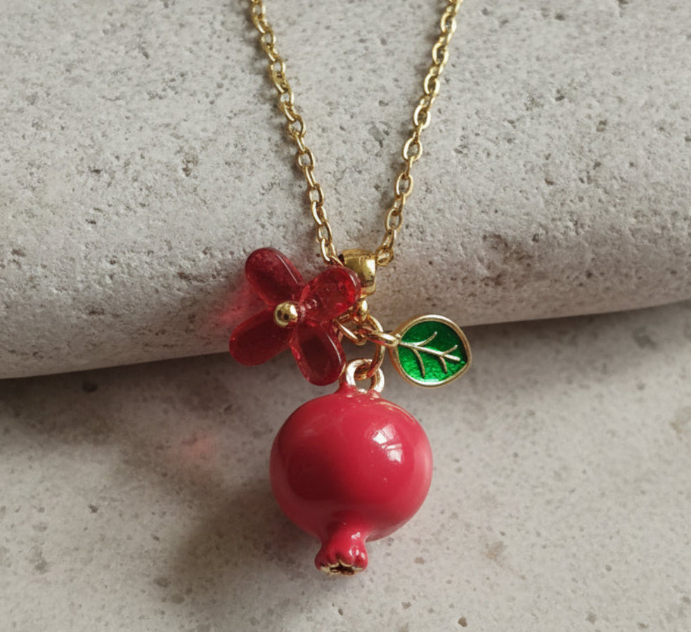 Handmade pomegranate enamel pendant with glass flower and enamel green leaf