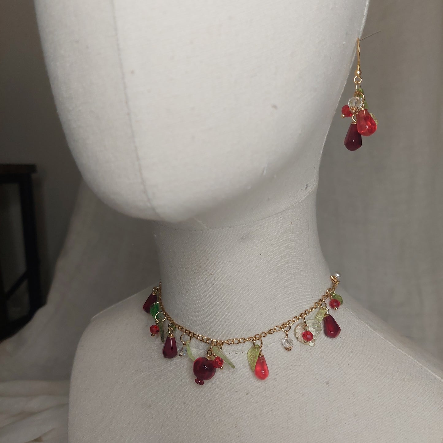 Handmade pomegranate jewelry with hypoallergenic gold plated stainless steel hardware and resin glass beads
