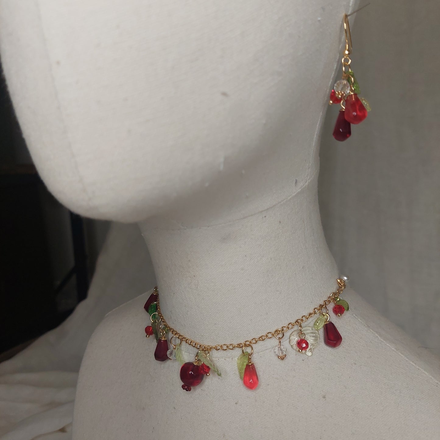 Handmade pomegranate jewelry with hypoallergenic gold plated stainless steel hardware and resin glass beads