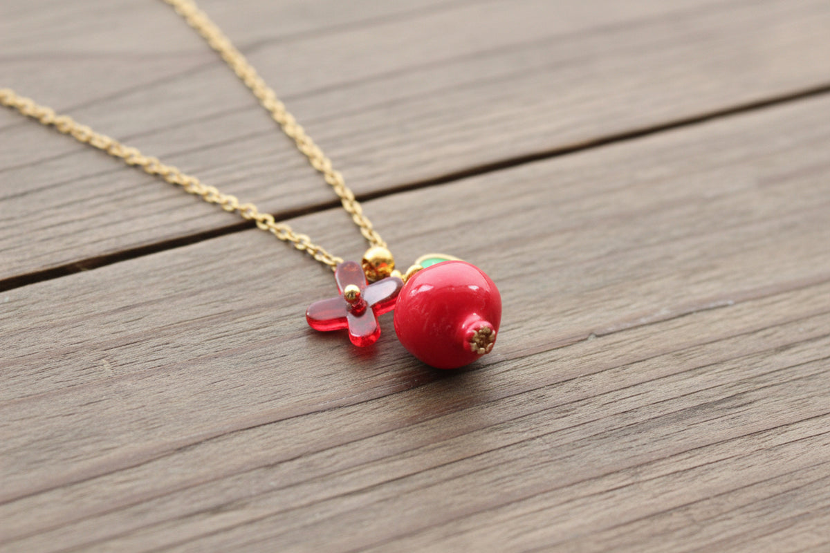 Handmade pomegranate enamel pendant with glass flower and enamel green leaf