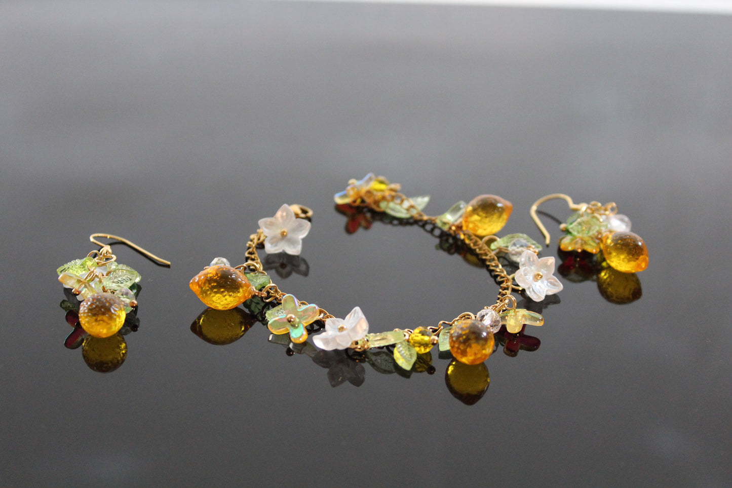 Handmade lemon  jewelry with hypoallergenic gold plated stainless steel hardware and resin glass beads