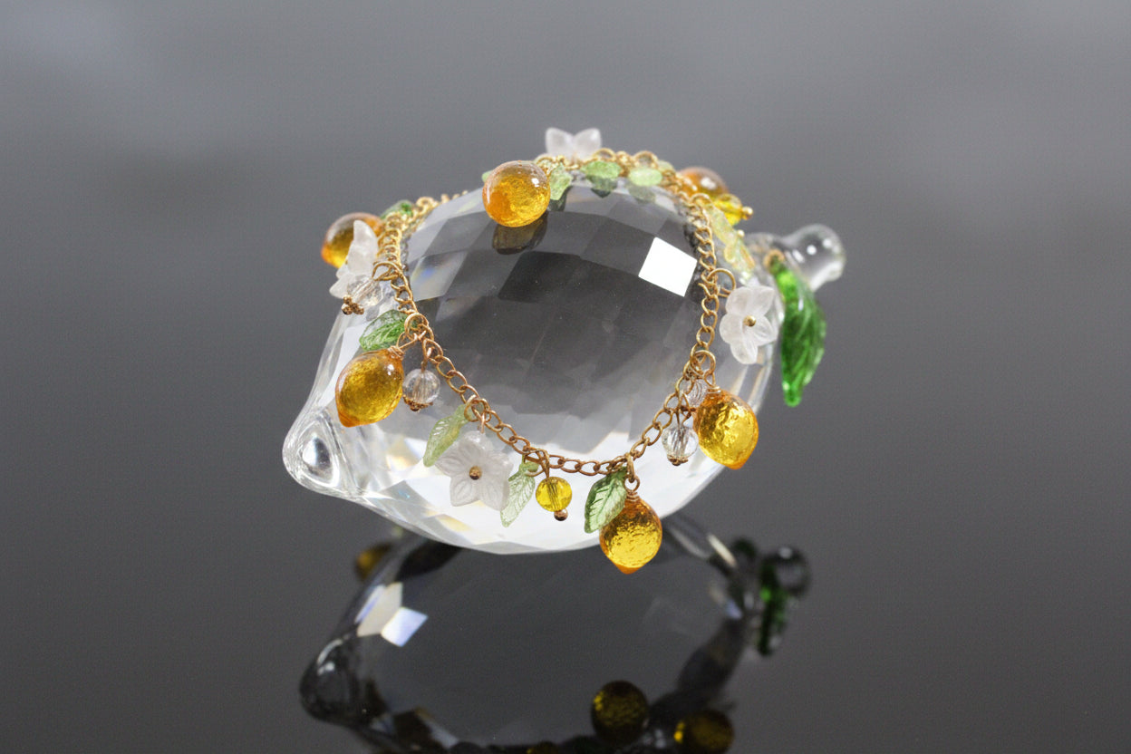 Handmade lemon  jewelry with hypoallergenic gold plated stainless steel hardware and resin glass beads