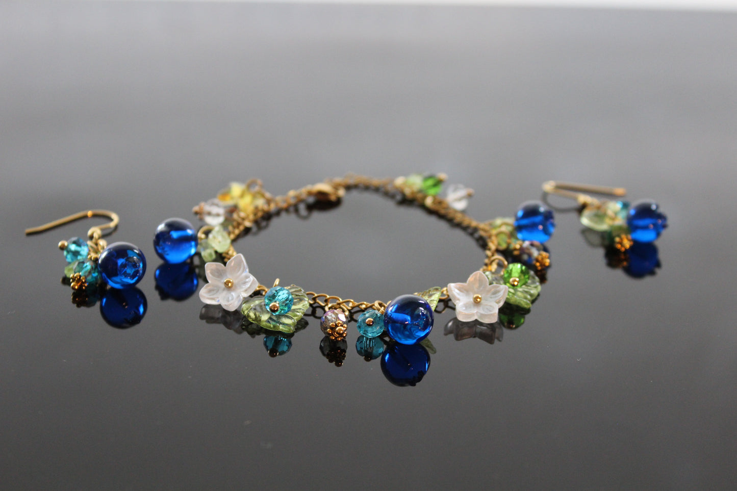 Handmade  blueberry jewelry with hypoallergenic gold plated stainless steel hardware and resin glass beads
