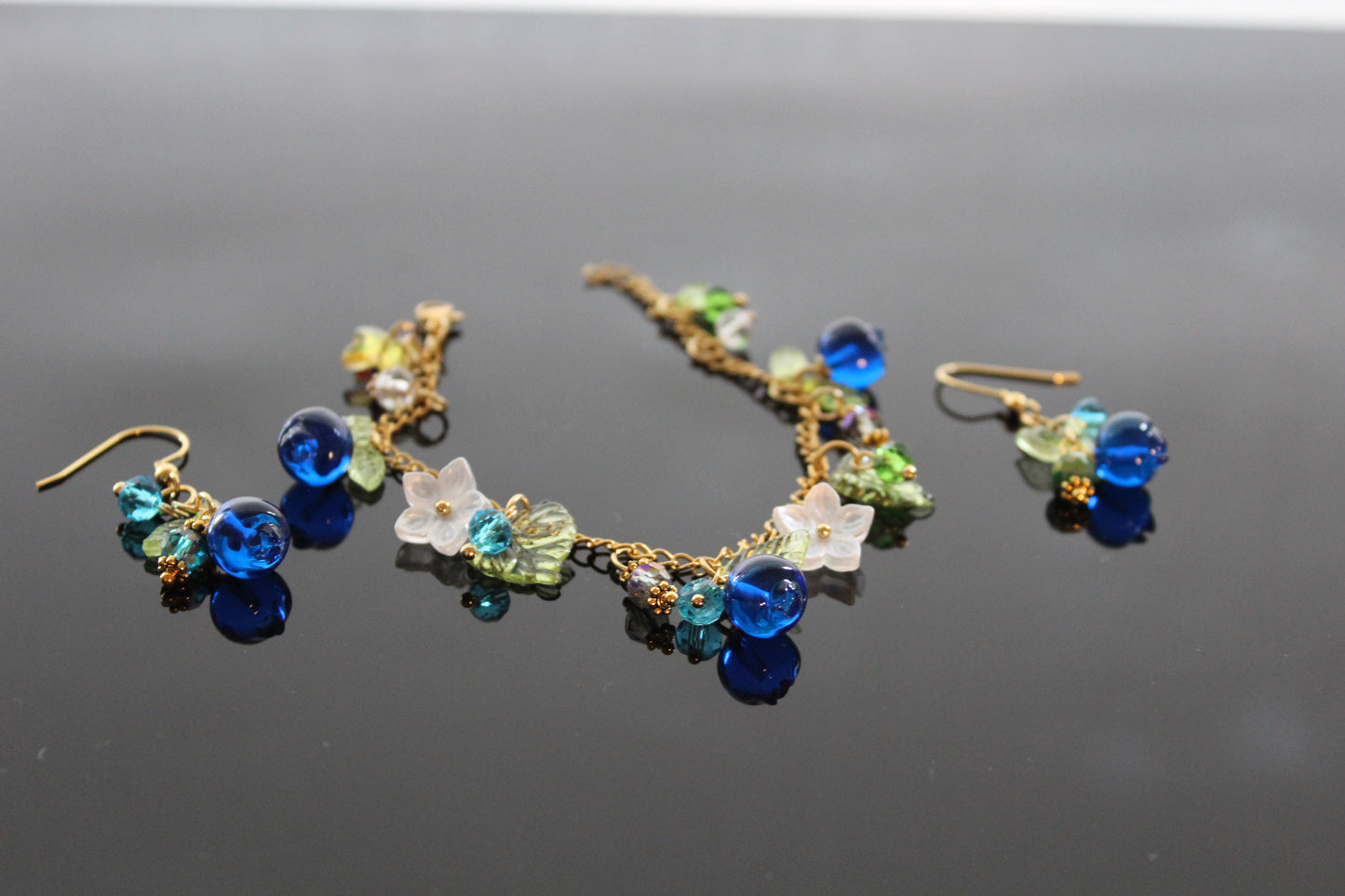 Handmade  blueberry jewelry with hypoallergenic gold plated stainless steel hardware and resin glass beads