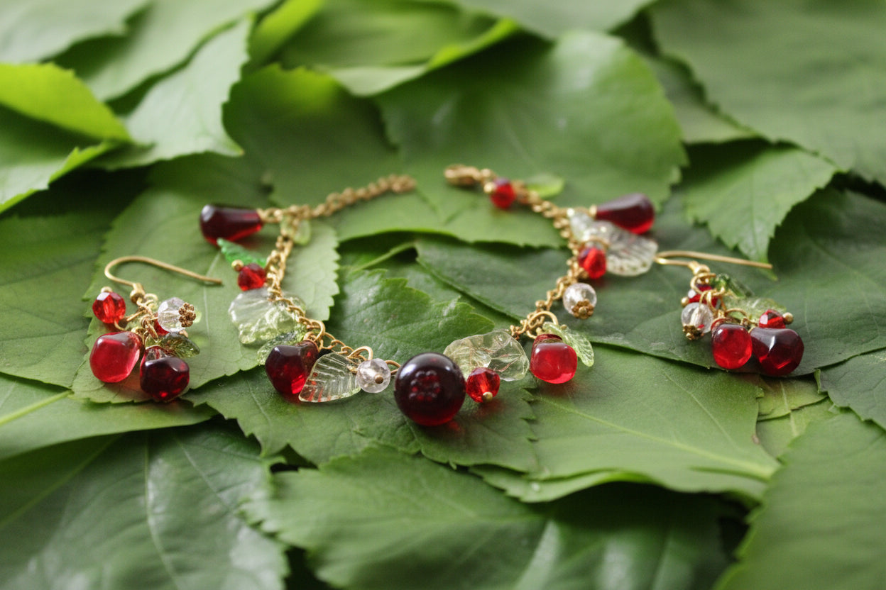 Handmade pomegranate jewelry with hypoallergenic gold plated stainless steel hardware and resin glass beads