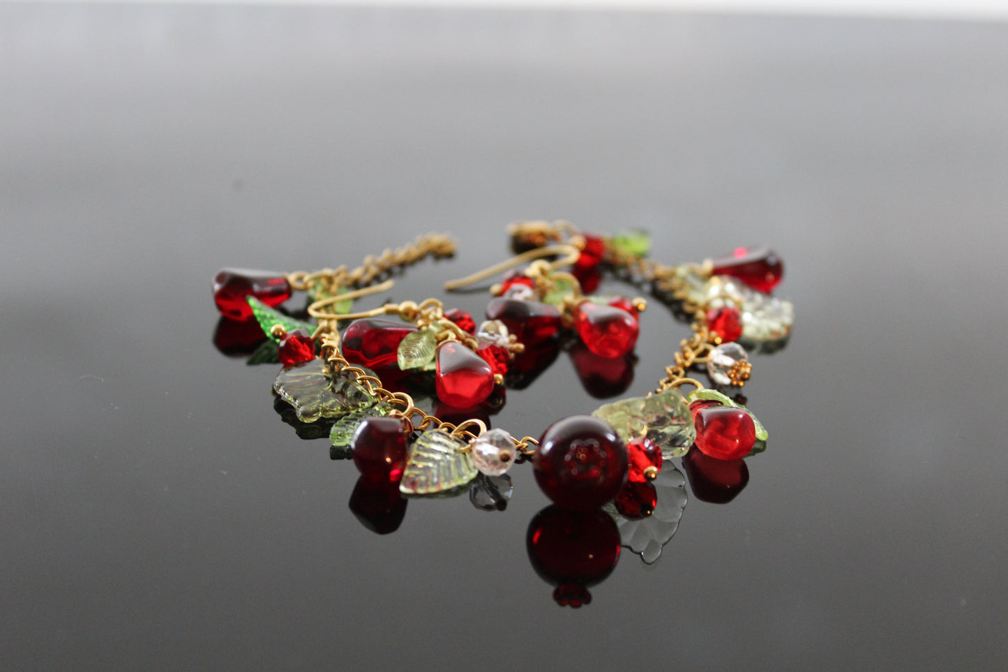 Handmade pomegranate jewelry with hypoallergenic gold plated stainless steel hardware and resin glass beads