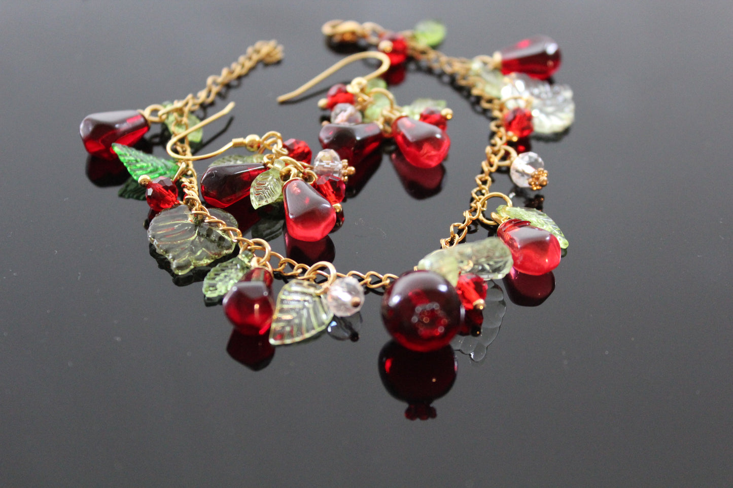 Handmade pomegranate jewelry with hypoallergenic gold plated stainless steel hardware and resin glass beads