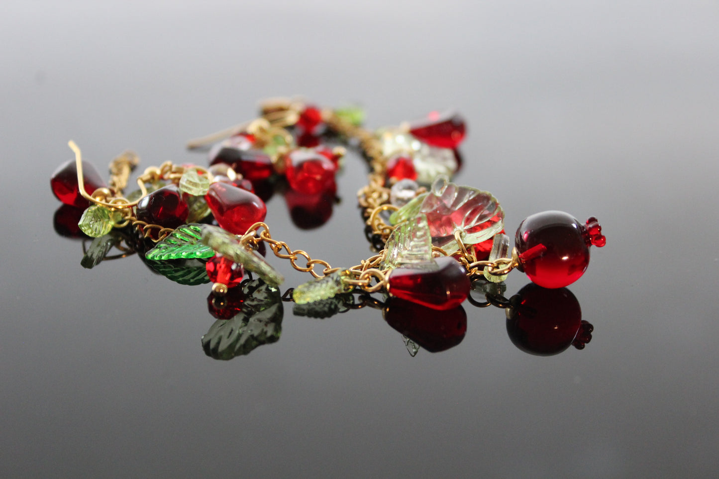 Handmade pomegranate jewelry with hypoallergenic gold plated stainless steel hardware and resin glass beads