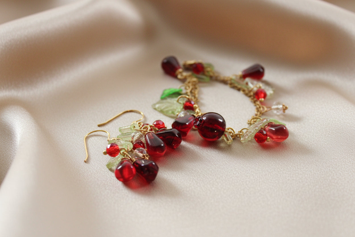 Handmade pomegranate jewelry with hypoallergenic gold plated stainless steel hardware and resin glass beads