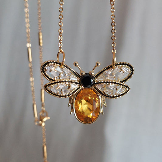 Gold plated bee pendant with natural onyx and crystals