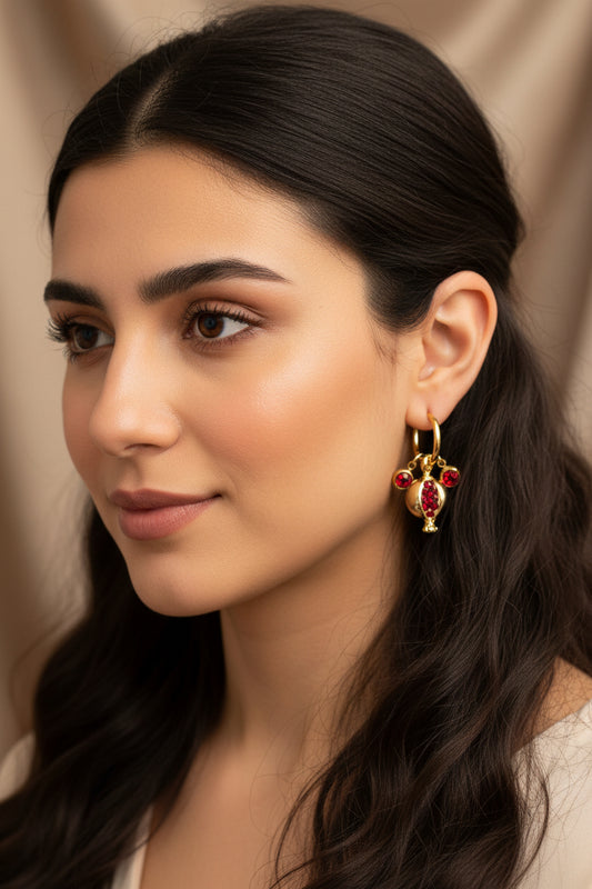 Gold plated pomegranate hoop earrings with red zircons