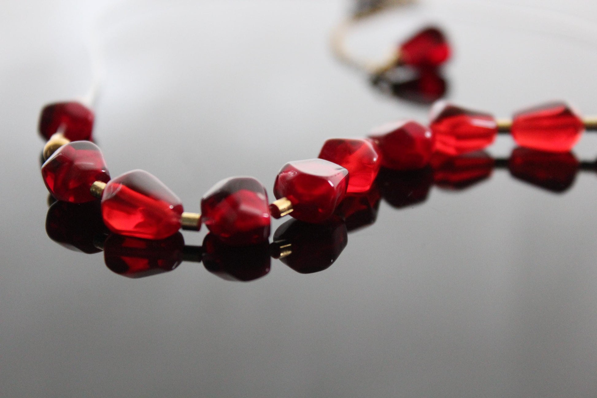 Pomegranates resin seeds on see-through wire