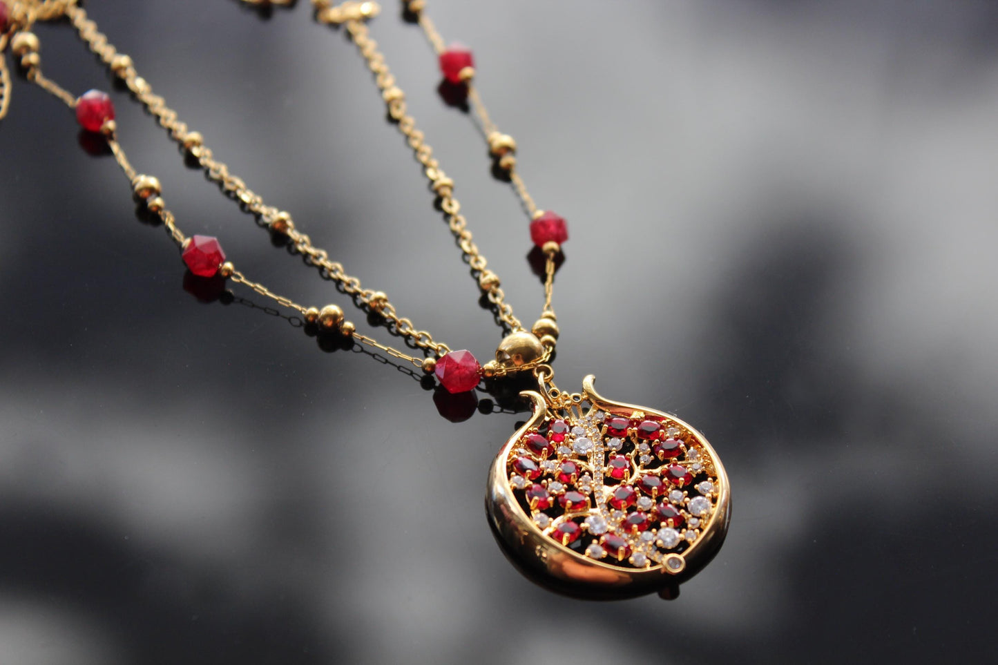 Pomegranate pendant with zircons and glass beads and stainless steel chain