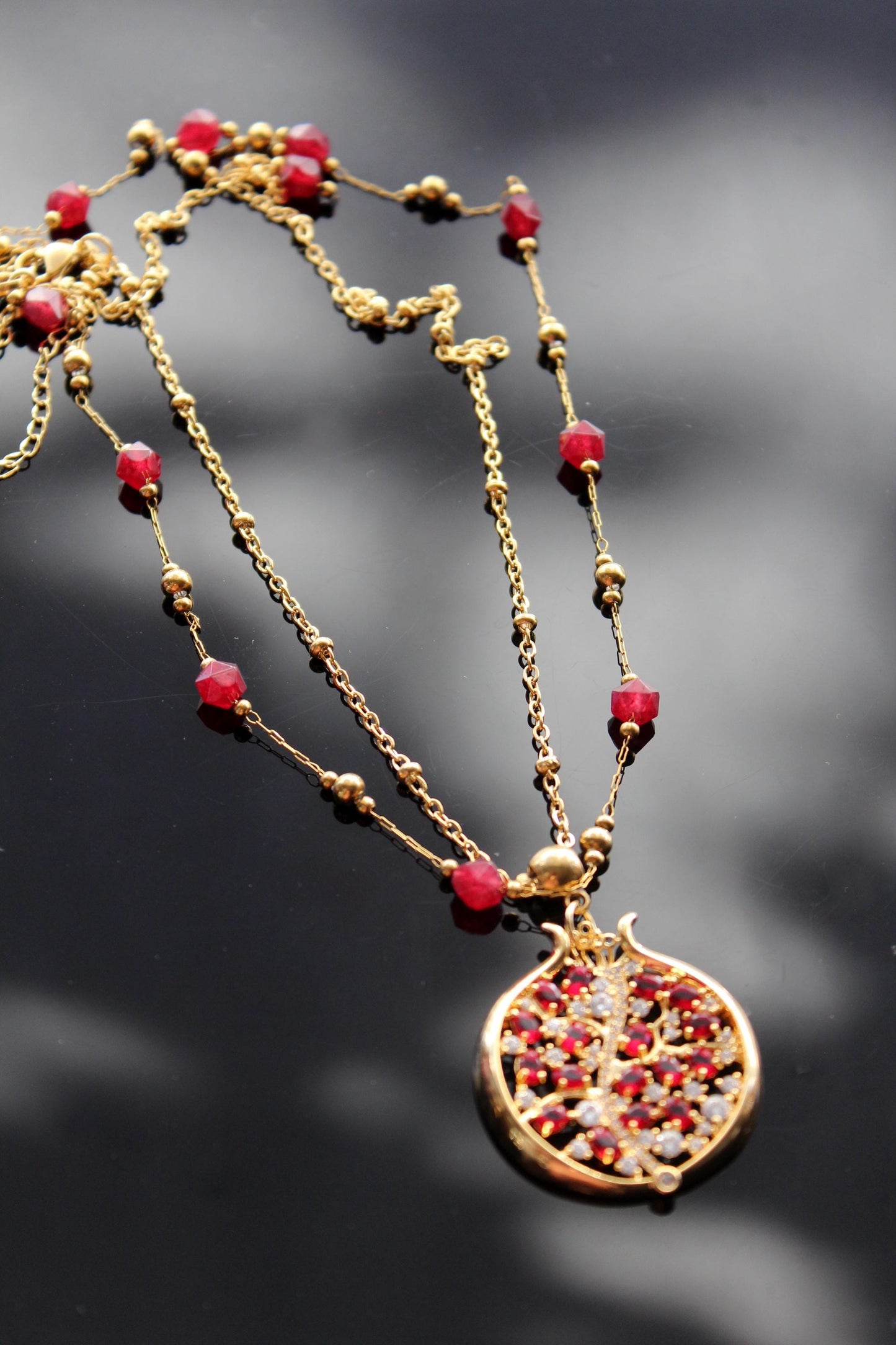 Pomegranate pendant with zircons and glass beads and stainless steel chain