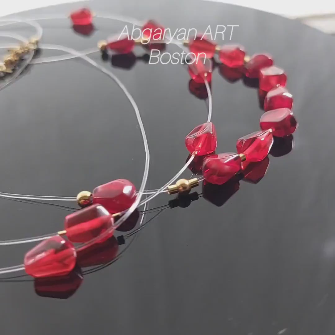Pomegranates resin seeds on see-through  wire